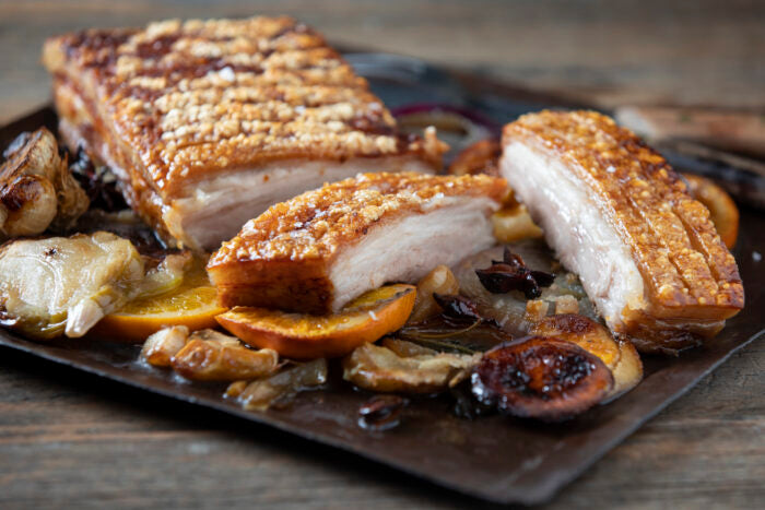 Roast pork belly with orange, apple, sage & garlic